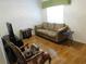 Cozy living room with natural light and comfortable seating at 2160 Addison Ave, Clermont, FL 34711