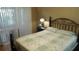 Cozy bedroom with a comfortable bed and a bright window with natural light at 2160 Addison Ave, Clermont, FL 34711
