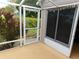 Relaxing screened patio with garden view and natural light, perfect for outdoor enjoyment at 2160 Addison Ave, Clermont, FL 34711