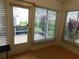 Screened lanai with ample natural light offers relaxing views of the backyard at 2160 Addison Ave, Clermont, FL 34711