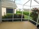 Enclosed patio showcases lush landscaping and outdoor space at 2160 Addison Ave, Clermont, FL 34711