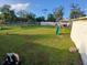 Large backyard with fencing and playground equipment, providing ample space for outdoor enjoyment at 2211 New Jersey Rd, Lakeland, FL 33803