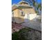 Side exterior showcasing air conditioning unit and partial view of the enclosed backyard at 2211 New Jersey Rd, Lakeland, FL 33803