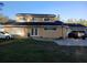 Charming two-story home with well-maintained lawn and a spacious driveway for multiple cars at 2211 New Jersey Rd, Lakeland, FL 33803