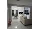 Spacious living room showcasing marble flooring, neutral decor, and an open layout to the dining area at 2211 New Jersey Rd, Lakeland, FL 33803