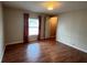 Empty bedroom with wood-look floors and ample sunlight at 222 Palmer Park Ln, Davenport, FL 33897