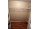 Walk-in closet with wire shelving and wood-look floors, providing practical storage at 222 Palmer Park Ln, Davenport, FL 33897