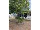 Exterior view of the house with a screened in porch and manicured landscaping at 222 Palmer Park Ln, Davenport, FL 33897