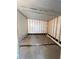View of a bare garage with wood framing and concrete flooring in the property at 222 Palmer Park Ln, Davenport, FL 33897