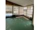 Enclosed sun room with many windows at 222 Palmer Park Ln, Davenport, FL 33897