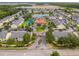 Scenic aerial view of condo community featuring central pond, recreation area, and lush landscaping at 2794 Club Cortile Cir # B, Kissimmee, FL 34746