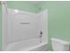 Bathroom with tub and shower and white toilet at 2794 Club Cortile Cir # B, Kissimmee, FL 34746