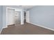 Bright bedroom features plush carpet, a mirrored closet, and a window for natural light at 2794 Club Cortile Cir # B, Kissimmee, FL 34746