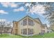 Rear exterior view showing a private screened-in patio and second-story balcony with convenient stair access at 2794 Club Cortile Cir # B, Kissimmee, FL 34746