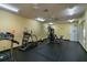 Well-lit gym featuring cardio equipment, weight machines, and a black rubber floor at 2794 Club Cortile Cir # B, Kissimmee, FL 34746