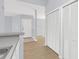 Hallway with hardwood floors and white doors at 2794 Club Cortile Cir # B, Kissimmee, FL 34746