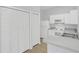 Kitchen view showcasing storage and white appliances at 2794 Club Cortile Cir # B, Kissimmee, FL 34746