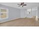 Open-concept living area featuring light-colored walls, modern flooring, and ample natural light at 2794 Club Cortile Cir # B, Kissimmee, FL 34746