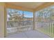 Outdoor patio with screened enclosure and view of a residential community at 2794 Club Cortile Cir # B, Kissimmee, FL 34746