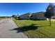 Large backyard, perfect for entertaining, with green grass, picnic table and grill at 3100 Rocky River Rd, Kissimmee, FL 34746
