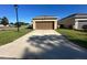 Detached garage with a long driveway and plenty of parking space at 3100 Rocky River Rd, Kissimmee, FL 34746