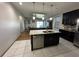 Kitchen island offers a breakfast bar and sink, opening to living area at 3100 Rocky River Rd, Kissimmee, FL 34746