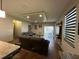Inviting living room with a comfortable sectional sofa, recessed lighting, and sliding glass doors for natural light at 3100 Rocky River Rd, Kissimmee, FL 34746