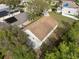 Home's backyard and trees are seen from above in this aerial view at 3193 Verbena Ct, Deltona, FL 32725