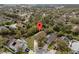Expansive aerial view of a neighborhood showcasing mature trees and well-maintained homes in a suburban setting at 3193 Verbena Ct, Deltona, FL 32725