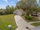 One-story home with a long driveway sits in the middle of a luscious green lawn at 3193 Verbena Ct, Deltona, FL 32725