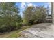 Backyard with a patio area and trees providing ample shade at 3193 Verbena Ct, Deltona, FL 32725