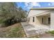 Backyard with a patio area and trees providing ample shade at 3193 Verbena Ct, Deltona, FL 32725