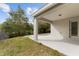 Backyard with a covered patio area and trees providing ample shade at 3193 Verbena Ct, Deltona, FL 32725