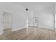 Bright bedroom featuring wood flooring, walk-in closet, and a private outdoor access at 3193 Verbena Ct, Deltona, FL 32725