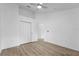 Bright bedroom with closet, ceiling fan, and wood flooring at 3193 Verbena Ct, Deltona, FL 32725