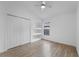 Cozy bedroom with closet, modern shelving, and wood flooring at 3193 Verbena Ct, Deltona, FL 32725