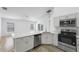 Modern kitchen with stainless steel appliances and a quartz countertop at 3193 Verbena Ct, Deltona, FL 32725
