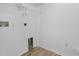 Bright laundry room with wood-style floors and hookups for appliances at 3193 Verbena Ct, Deltona, FL 32725
