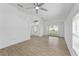 Open-concept living room featuring updated flooring and natural light at 3193 Verbena Ct, Deltona, FL 32725