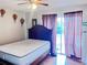 Bedroom with hardwood floors and a sliding door at 326 Hanging Moss Rd, Davenport, FL 33837
