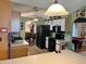 Eat in kitchen with a table, with black appliances and white upper cabinets at 326 Hanging Moss Rd, Davenport, FL 33837