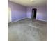 Room featuring carpeted floors, neutral walls, a window and entryway and an electrical cord on the floor at 3557 Valleyview Dr, Kissimmee, FL 34746