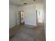Bright bedroom featuring carpet floors and neutral walls with access to a bathroom and closet at 3557 Valleyview Dr, Kissimmee, FL 34746
