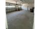 Spacious three-car garage with ample storage space and doors at 3557 Valleyview Dr, Kissimmee, FL 34746