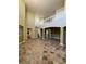 Expansive living room showcasing marble tile floors, high ceilings, and a second-story view at 3557 Valleyview Dr, Kissimmee, FL 34746