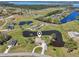 Scenic view of the property highlighting the lakefront location, manicured lawn, and serene surroundings at 3607 Hidden River Ln, Tavares, FL 32778