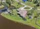 Beautiful aerial shot showcasing the home's private waterfront location with a dock and lush surroundings at 3607 Hidden River Ln, Tavares, FL 32778