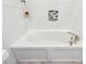 Bright bathroom features a soaking tub, white tiles and modern fixtures for a relaxing experience at 3607 Hidden River Ln, Tavares, FL 32778