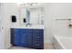 Elegant bathroom with a double vanity, modern fixtures, and plenty of counter space at 3607 Hidden River Ln, Tavares, FL 32778