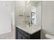 Bathroom vanity with white countertop and framed mirror at 3607 Hidden River Ln, Tavares, FL 32778